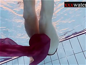 Smoking steamy Russian redhead in the pool